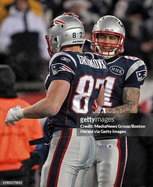 New England Patriots tight end Aaron Hernandez celebrates with tight end Rob Gronkowski after his fourth quarter run during the AFC Divisional...