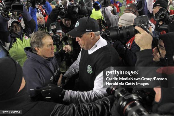 New England Patriots head coach Bill Belichick and New York Jets head coach Rex Ryan shake hands after the AFC divisional round at Gillette Stadium...