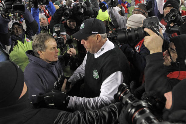 New England Patriots head coach Bill Belichick and New York Jets head coach Rex Ryan shake hands after the AFC divisional round at Gillette Stadium...