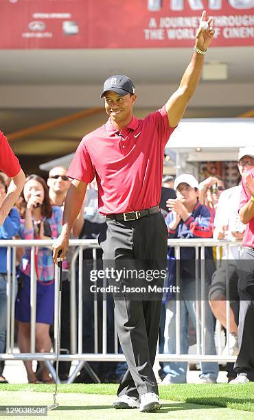 Golfer Tiger Woods announces the 2011 Chevron World Challenge field and putt with local fans on October 11, 2011 in Los Angeles, California.