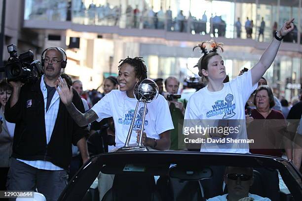 Seimone Augustus and Lindsay Whalen of the 2011 WNBA Champions Minnesota Lynx wave to the crowd during the Minnesota Lynx Championship Parade through...