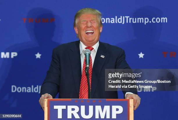 Republican candidate for President Donald Trump laughs as someone in the crowd makes a joke about Hillary Clinton as he speaks at an event in...