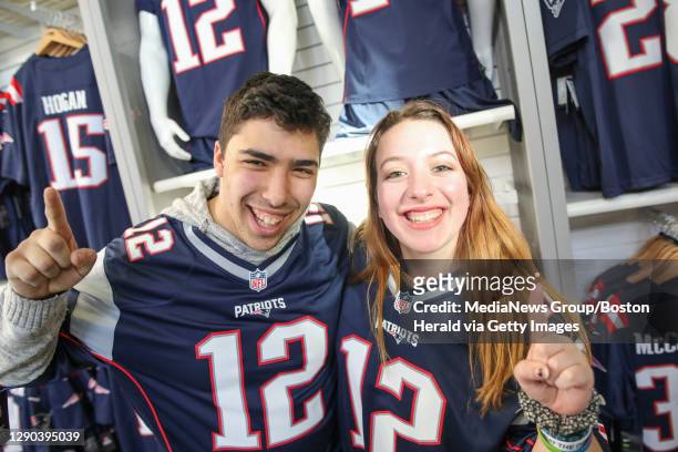 Matt Resnick and Emily Beaulieu, both of Lexington, gear up for the big game during a trip to the Patriots Pro shop at Gillette Stadium in Foxboro on...