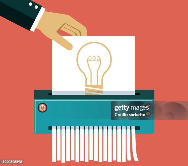 big hand inserts a paper with an idea light bulb - shredding stock illustrations