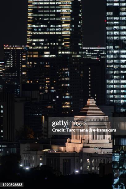 national diet building and city buildings in tokyo of japan - national diet building stock-fotos und bilder