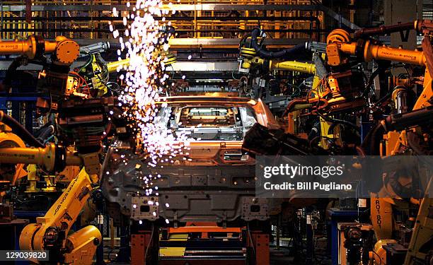 Chevy Volt electric vehicles and Opel Amperas go through assembly at the General Motors Detroit Hamtramck Assembly Plant October 11, 2011 in...