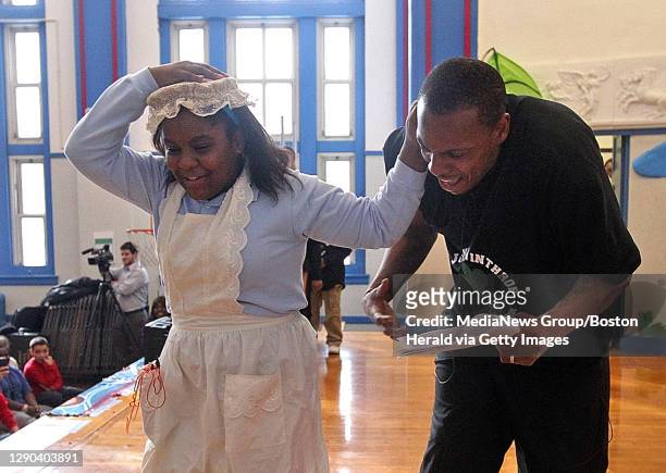 Boston, MA)The Boston Celtics' Paul Pierce is hauled off by the ear by "Grandma" aka 5th grader Luisa Desilva as they perform in a skit about the...