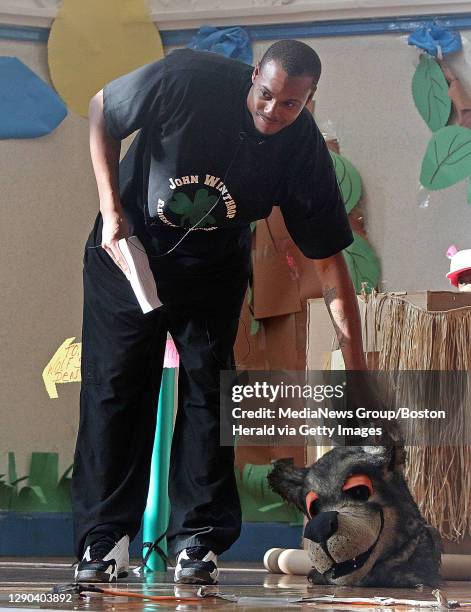 Boston, MA)The Boston Celtics' Paul Pierce talks off the Big Bad Wolf head as he performs in a skit about the Three Little Pigs at the John Winthrop...