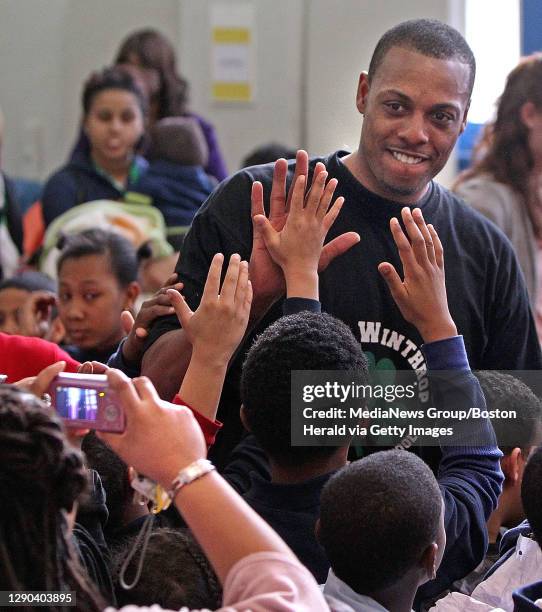 Boston, MA)The Boston Celtics' Paul Pierce high fives the kids after he performed in a skit about the Three Little Pigs at the John Winthrop...