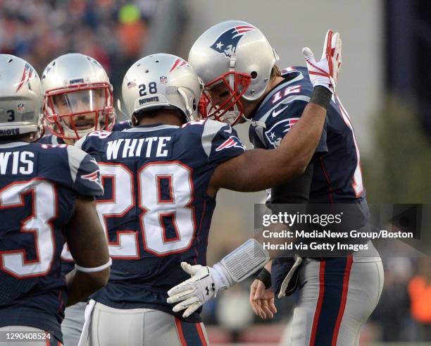 New England Patriots running back James White is congratulated by quarterback Tom Brady after White scored against the Jacksonville Jaguars during...