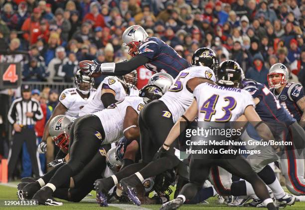 Foxboro, MA ÑNew England Patriots quarterback Tom Brady rushes over the top for a fourth quarter touchdown during a 23-20 victory in the AFC...