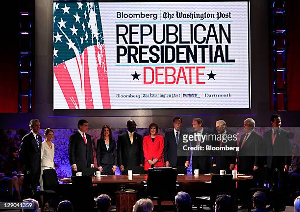 Republican presidential candidates and journalists including, left to right, Jon Huntsman, former governor of Utah, Michele Bachmann, a Republican...