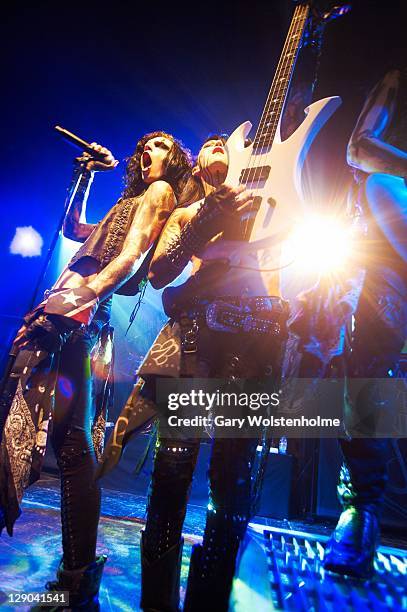 Andy Biersack and Ashley Purdy of Black Veil Brides performs on stage at Manchester Academy on October 11, 2011 in Manchester, United Kingdom.