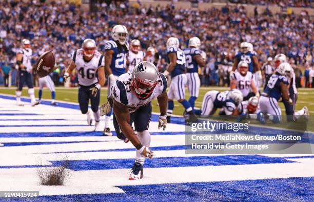 New England Patriots running back Jonas Gray spikes the ball after his fourth quarter touchdown against the Indianapolis Colts at Lucas Oil Stadium...