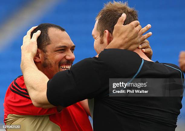 John Afoa and Ali Williams of the All Blacks warm up during a New Zealand All Blacks IRB Rugby World Cup 2011 training session at Trusts Stadium on...