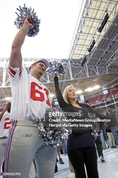 The New York Giants Media Day at the University of Phoenix Stadium. Kellie Pickler teaches New York Giants offensive tackle Adam Koets how to cheer...