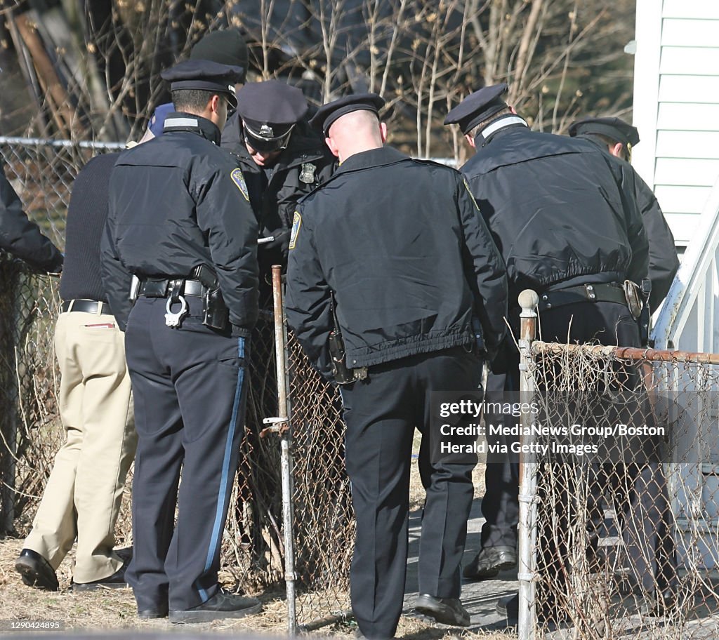 (013007  Boston, MA) MASSIVE POLICE EFFORT HITS PAY DIRT - Boston Police officers from Hyde Park  descended on Hyde Park High School on Metropolitan Ave. on Tuesday morning after a student uttered threats and was reported to have gone home to get wea