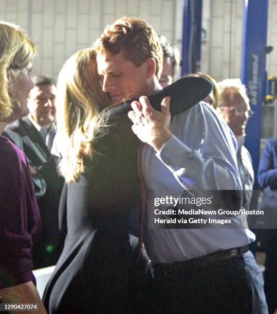 Mass Rep. Joe Kennedy III hug his wife, Lauren Birchfield at his rebuttal speech at Diman Vocational School. Tuesday, January 30, 2018.