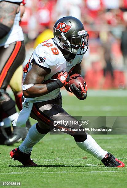 Kregg Lumpkin of the Tampa Bay Buccaneers runs with the ball against the San Francisco 49ers during an NFL football game at Candlestick Park on...