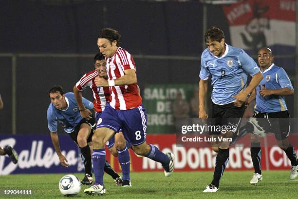 Edgar Barreto of Paraguay, fights for the ball with Sebastian Eguren of Uruguay, during the match between Paraguay and Uruguay as part of the first...