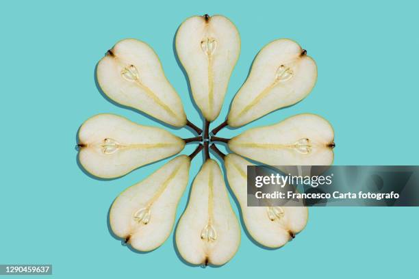 slices of pear in the shape of a flower - birne stock-fotos und bilder