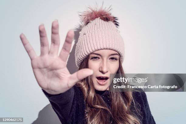 stop problem - woman shielding face stock pictures, royalty-free photos & images