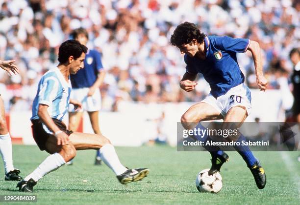 Paolo Rossi of Italy competes for the ball with Osvaldo César Ardiles of Argentina during the World Cup Spain 1982 match between Italy and Argentina...