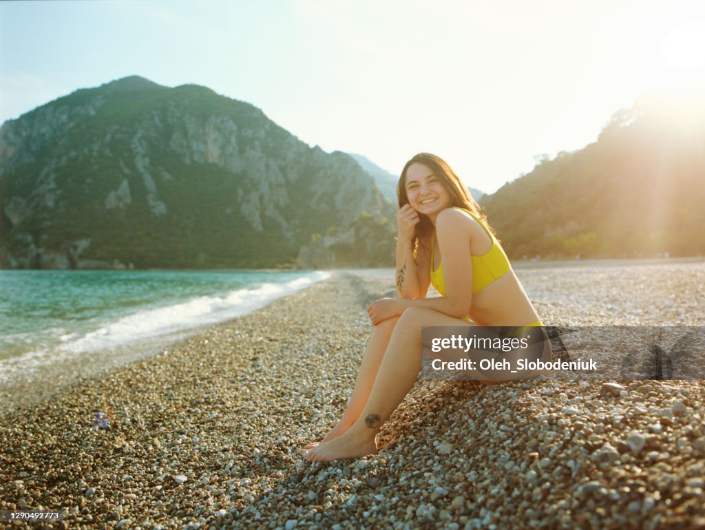 Woman resting  near the sea on Mediterranean coast in Turkey