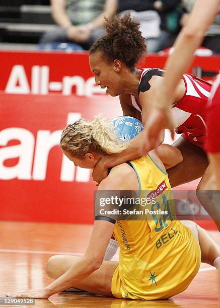 Erin Bell of Australia and Serena Guthrie of England contest possession during game two of the International Test series between the Australian...