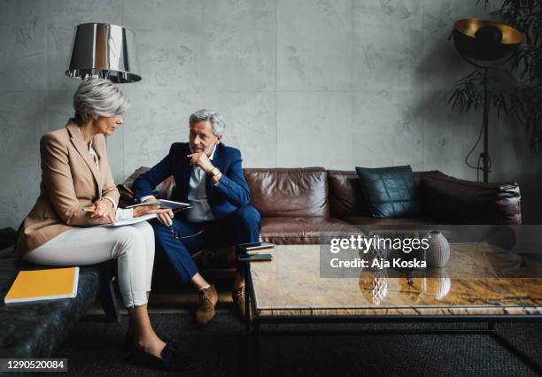 colleagues working together in the office. - well dressed couple stock pictures, royalty-free photos & images