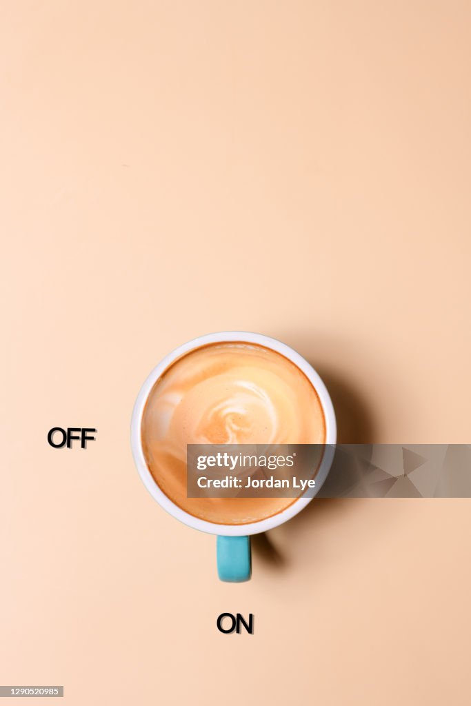 An empty glass cup of coffee on the beige background
