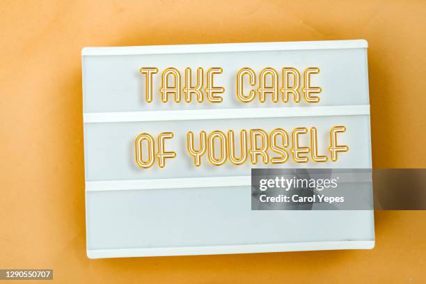 lightbox with  " take care of yourself " text - hope word stock pictures, royalty-free photos & images