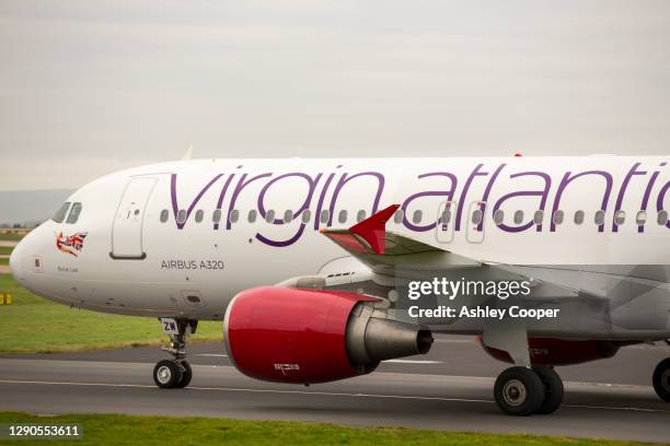 a virgin atlantic plane at manchester airport, uk. - manchester airport stock pictures, royalty-free photos & images