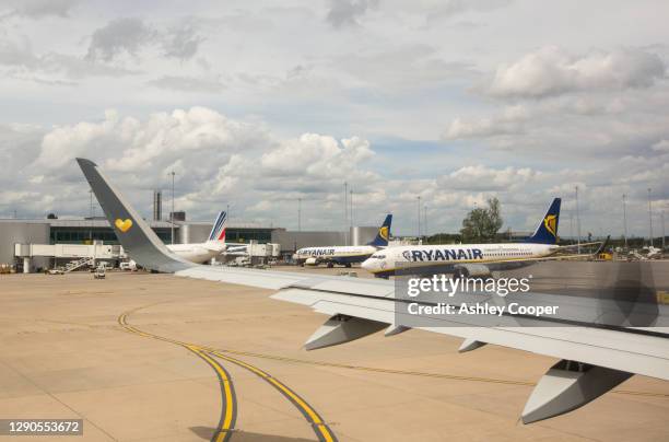 planes at manchester airport, uk. - manchester airport stock pictures, royalty-free photos & images