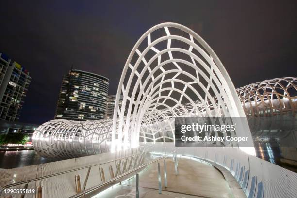 the webb bridge, a modern footbridge across the yarra river in melbourne, australia. - ashley webb stock pictures, royalty-free photos & images