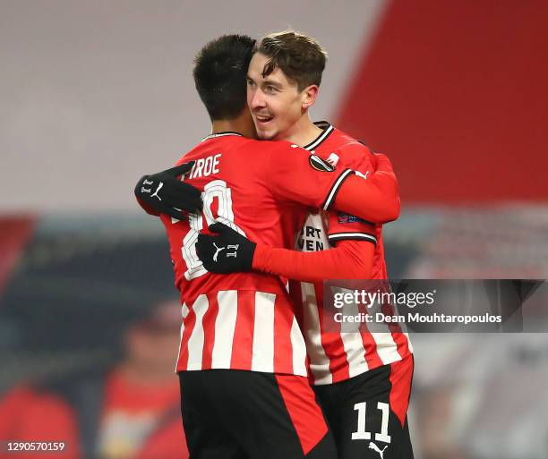 Joel Piroe of PSV Eindhoven celebrates with Adrian Fein of PSV Eindhoven after scoring his teams 4th goal during the UEFA Europa League Group E stage...