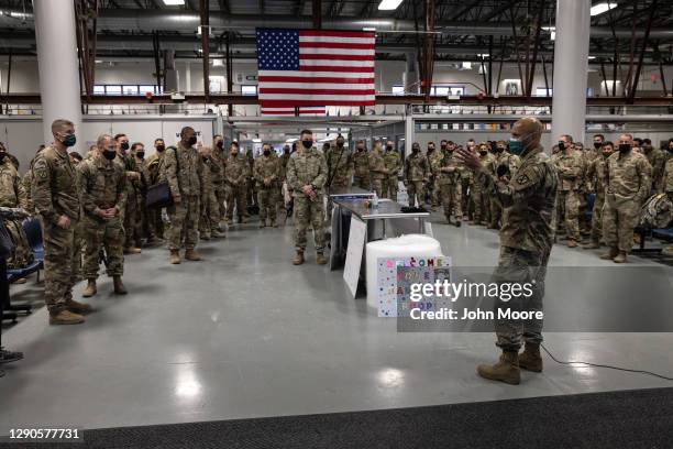 Army soldiers are briefed on COVID-19 quarantine procedures after returning home from a 9-month deployment to Afghanistan on December 10, 2020 at...
