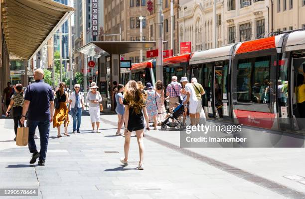 people shopping and enjoying day in the city, background with copy space - lightrail stock pictures, royalty-free photos & images