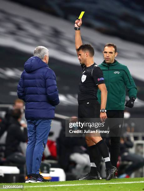 Jose Mourinho, Manager of Tottenham Hotspur is shown the yellow card by Jesus Gil Manzano during the UEFA Europa League Group J stage match between...