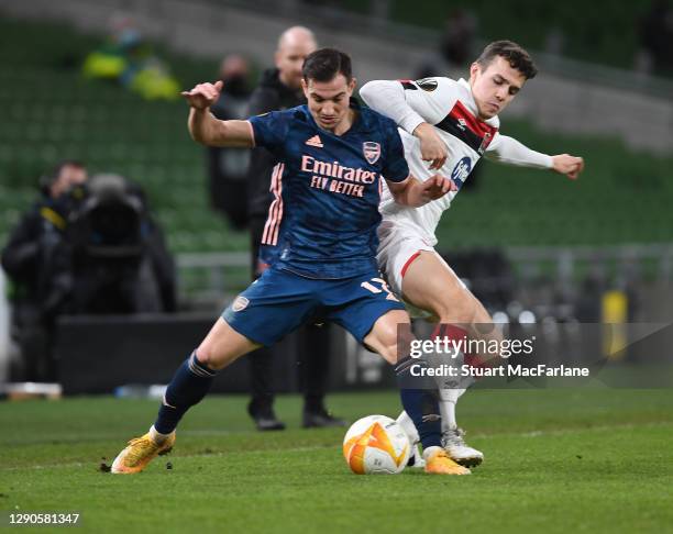 Cedric of Arsenal breaks past James Wynne of Dundak during the UEFA Europa League Group B stage match between Dundalk FC and Arsenal FC at Aviva...