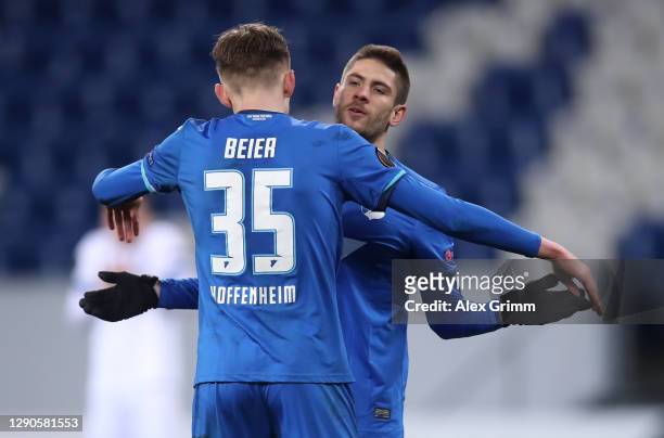 Andrej Kramaric of TSG 1899 Hoffenheim celebrates with Maximilian Beier of TSG 1899 Hoffenheim after scoring their team's fourth goal with his team...