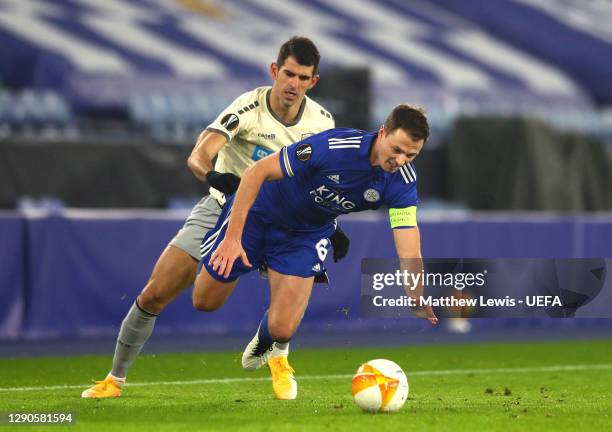 Nelson Oliveira of AEK collides with Jonny Evans of Leicester City during the UEFA Europa League Group G stage match between Leicester City and AEK...