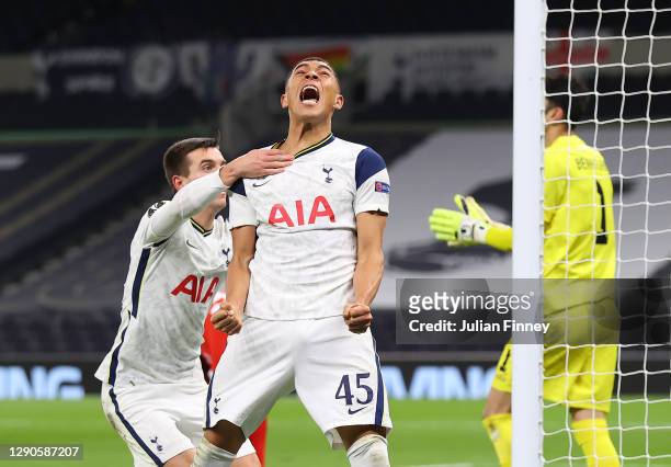 Carlos Vinicius of Tottenham Hotspur celebrates with Giovani Lo Celso of Tottenham Hotspur after scoring his sides 1st goal after scoring their...
