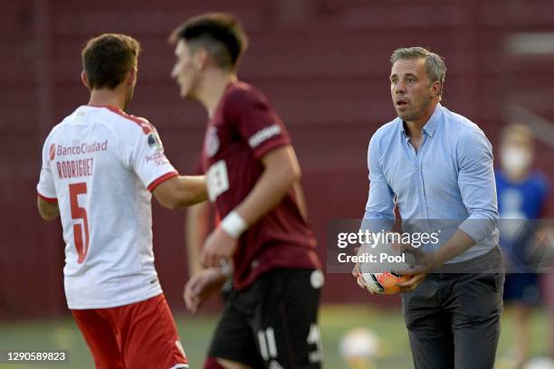 Lucas Pusineri head coach of Independiente holds a match ball during a first leg match between Lanus and Independiente as part of Copa CONMEBOL...