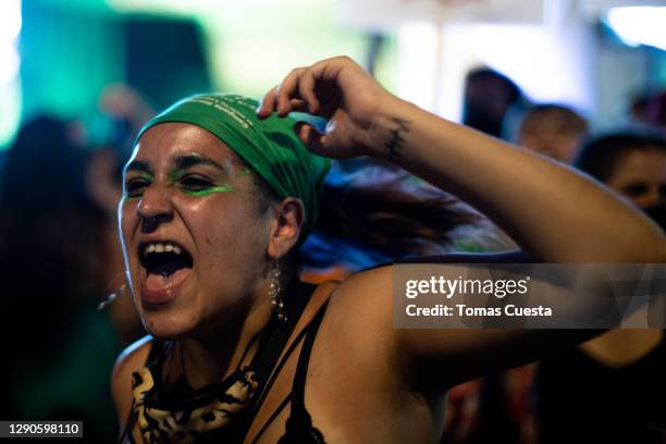 Pro-choice activist chants outside the National Congress as Deputies vote on a bill to legalize abortion on December 10, 2020 in Buenos Aires,...