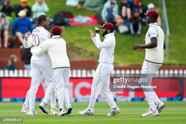 Shannon Gabriel of West Indies celebrates after taking the wicket of Ross Taylor of New Zealand during day one of the second test match in the series...