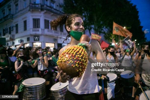 Pro-choice activist dances during a protest outside the National Congress as Deputies vote on a bill to legalize abortion on December 10, 2020 in...