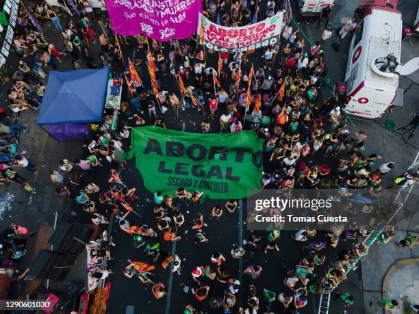 Aerial view of pro-choice activists displaying a banner that reads in Spanihs 'Legal Abortion' outside the National Congress as Deputies vote on a...