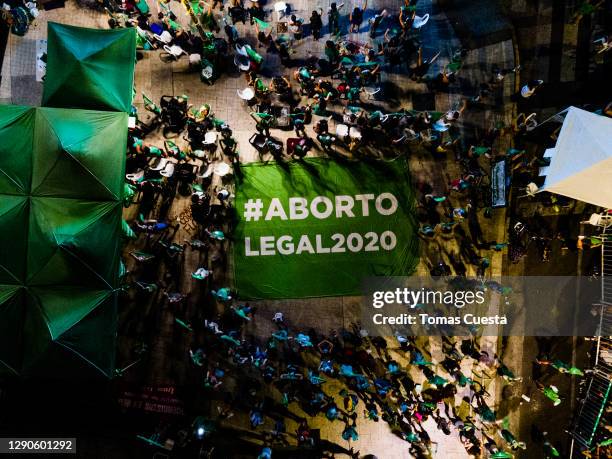 Aerial view of pro-choice activists displaying a banner that reads in Spanihs 'Legal Abortion' outside the National Congress as Deputies vote on a...