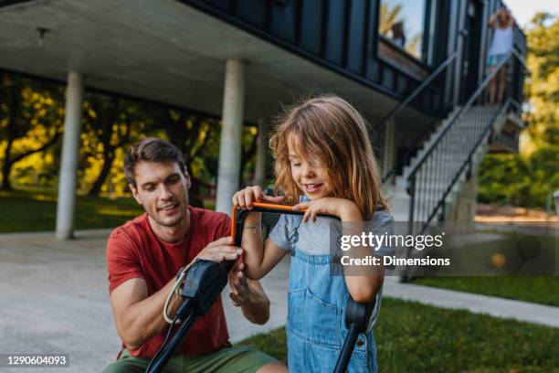 parenthood - what a priceless experience - dad mowing stock pictures, royalty-free photos & images